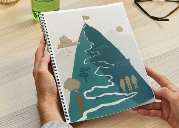 Workbook mit Bergillustration auf dem Cover